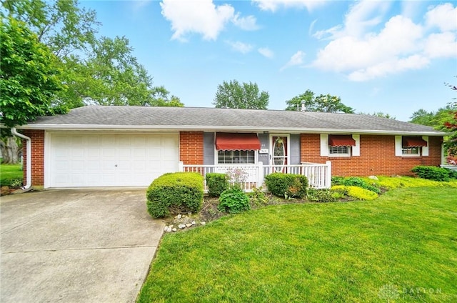 144 Tuxworth Rd, Dayton, OH 45458 - single story home with a garage, concrete driveway, and brick siding