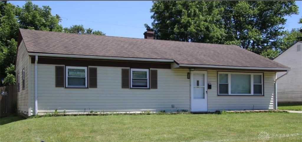 1260 Apple St, Fairborn, OH 45324 - view of front of property featuring a front yard, a chimney, and roof with shingles