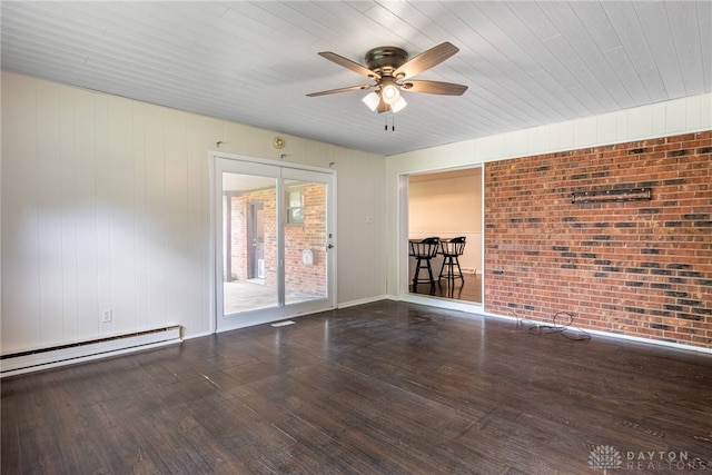 3558 Knollbrook Dr, Franklin Twp, OH 45005 - spare room with a baseboard radiator, a ceiling fan, wood finished floors, and brick wall
