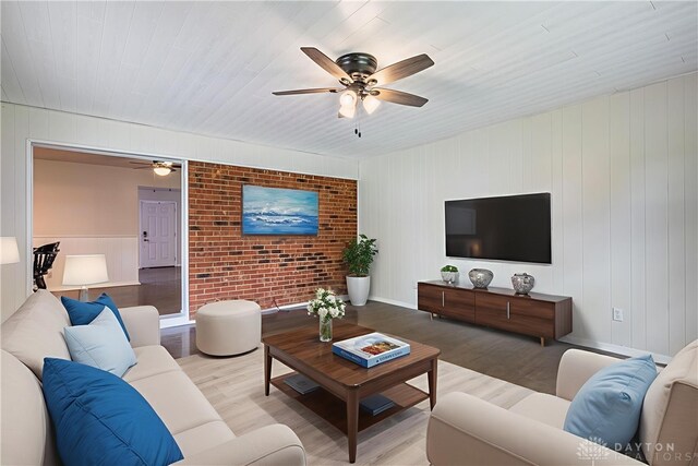 3558 Knollbrook Dr, Franklin Twp, OH 45005 - living room featuring wood finished floors, a ceiling fan, wood ceiling, and brick wall