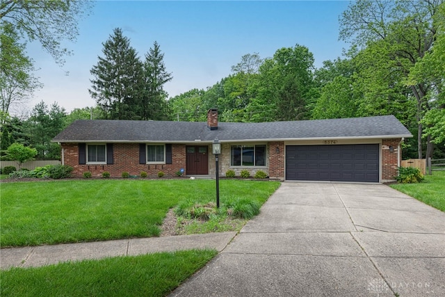 5374 Oak Bend Cir, Kettering, OH 45440 - ranch-style home featuring a garage, a chimney, concrete driveway, brick siding, and roof with shingles