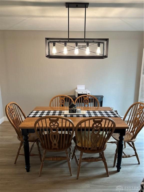2419 Meadow Green Dr, Beavercreek, OH 45431 - dining area with light wood-type flooring and baseboards