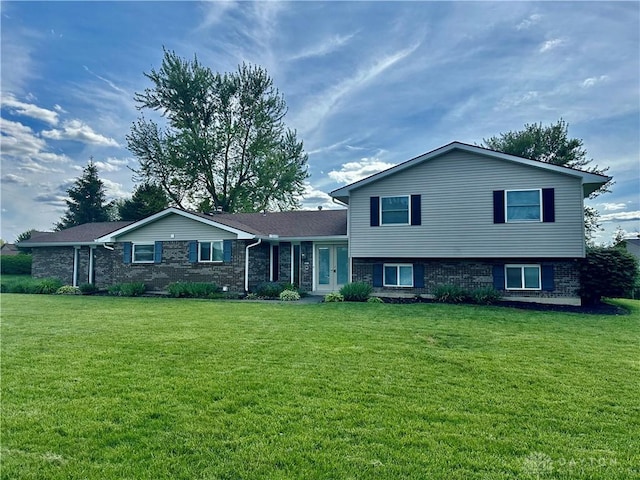 2419 Meadow Green Dr, Beavercreek, OH 45431 - split level home featuring a front lawn, french doors, and brick siding