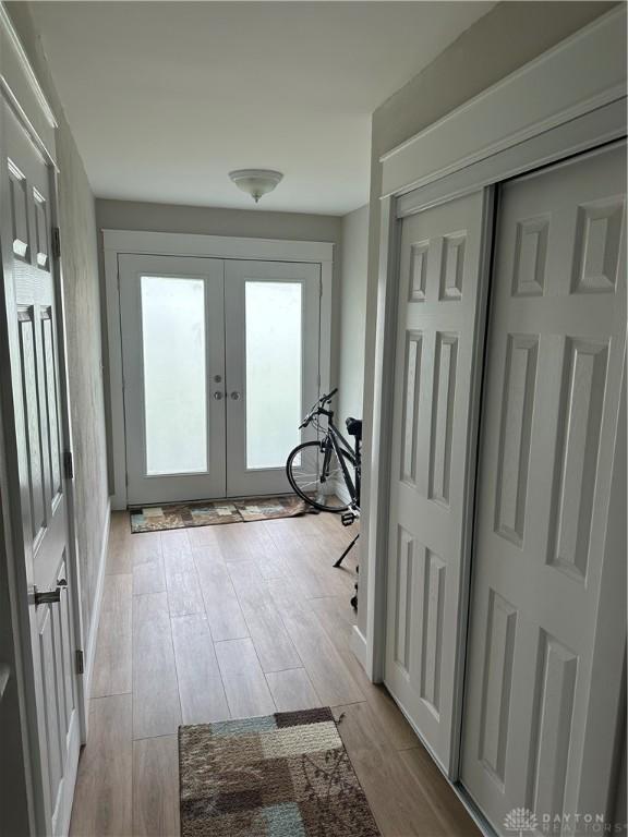 2419 Meadow Green Dr, Beavercreek, OH 45431 - corridor with french doors and light wood-style flooring