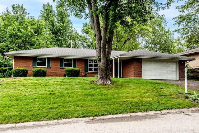 5920 Verdi Dr, West Carrollton, OH 45449 - single story home with a garage, driveway, a front lawn, and brick siding