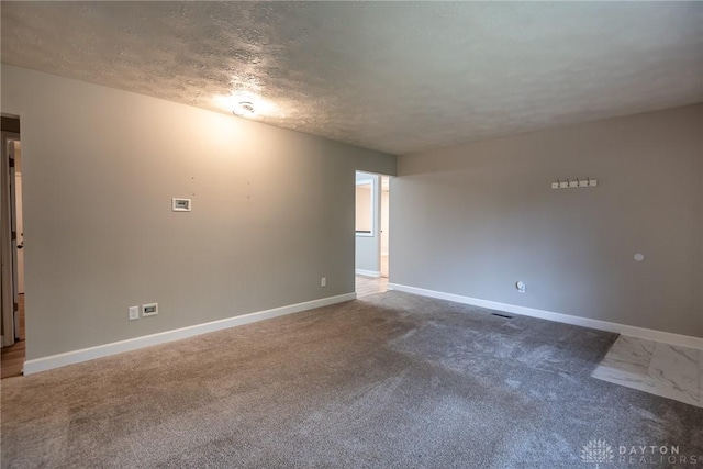 5920 Verdi Dr, West Carrollton, OH 45449 - empty room featuring baseboards, carpet floors, and a textured ceiling