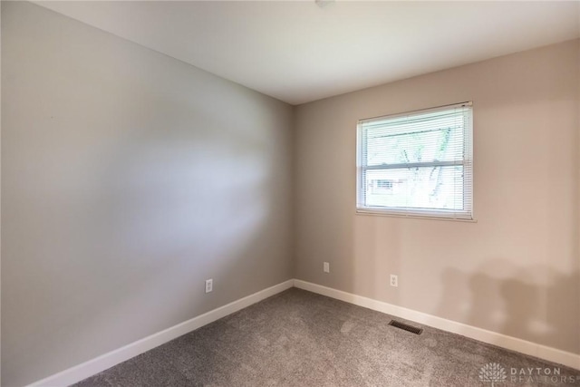 5920 Verdi Dr, West Carrollton, OH 45449 - empty room with baseboards and dark colored carpet