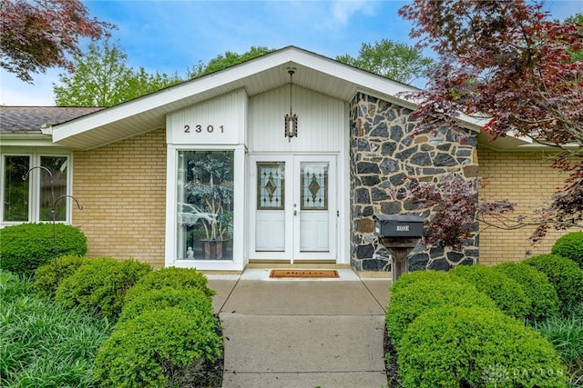 2301 Glenheath Dr, Kettering, OH 45440 - entrance to property with brick siding and a shingled roof