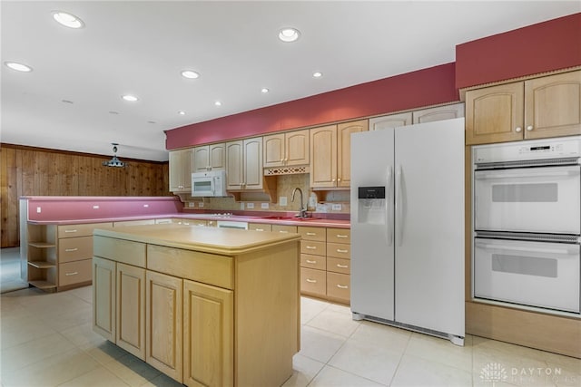2301 Glenheath Dr, Kettering, OH 45440 - kitchen with white appliances, a center island, a sink, light tile patterned floors, and light brown cabinetry