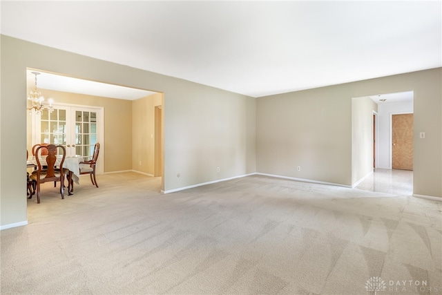 2301 Glenheath Dr, Kettering, OH 45440 - unfurnished room with a chandelier, carpet, and baseboards
