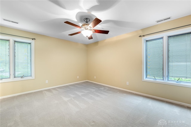 2301 Glenheath Dr, Kettering, OH 45440 - empty room with plenty of natural light, ceiling fan, and baseboards