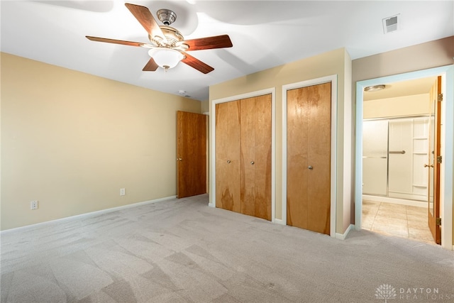 2301 Glenheath Dr, Kettering, OH 45440 - unfurnished bedroom featuring carpet flooring, multiple closets, baseboards, and ensuite bathroom