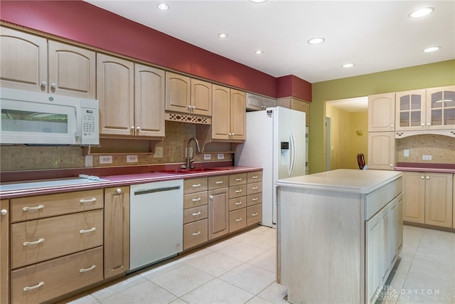 2301 Glenheath Dr, Kettering, OH 45440 - kitchen featuring white appliances, light tile patterned floors, a center island, glass insert cabinets, and a sink