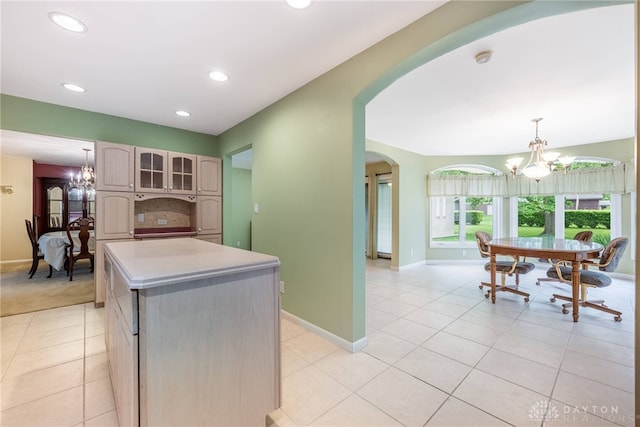 2301 Glenheath Dr, Kettering, OH 45440 - kitchen featuring arched walkways, a chandelier, light tile patterned floors, a kitchen island, and recessed lighting
