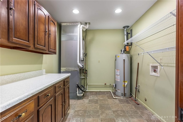 2301 Glenheath Dr, Kettering, OH 45440 - washroom featuring water heater, hookup for a washing machine, recessed lighting, baseboards, and heating unit