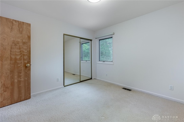 2301 Glenheath Dr, Kettering, OH 45440 - unfurnished bedroom with carpet flooring, baseboards, and a closet