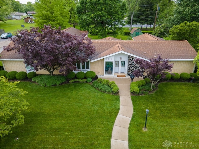 2301 Glenheath Dr, Kettering, OH 45440 - view of front of house featuring a front lawn and roof with shingles
