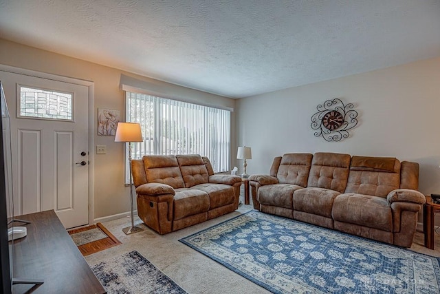 286 Chamberlin Dr, Hamilton, OH 45013 - carpeted living room with healthy amount of natural light, a textured ceiling, and baseboards