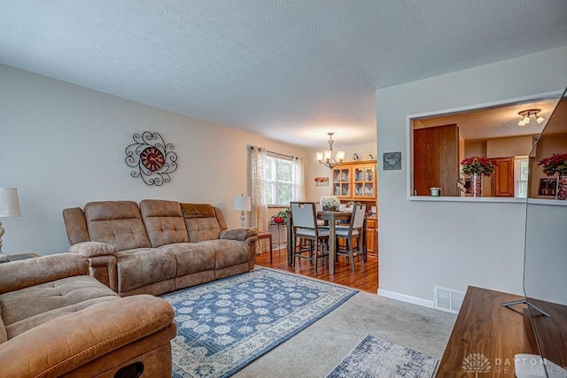 286 Chamberlin Dr, Hamilton, OH 45013 - living area with a chandelier, carpet, baseboards, and a textured ceiling