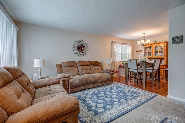 286 Chamberlin Dr, Hamilton, OH 45013 - carpeted living area featuring a chandelier and baseboards