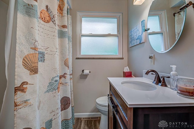 286 Chamberlin Dr, Hamilton, OH 45013 - bathroom with vanity, toilet, baseboards, and curtained shower