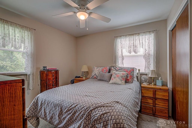 286 Chamberlin Dr, Hamilton, OH 45013 - carpeted bedroom with multiple windows, a closet, and a ceiling fan