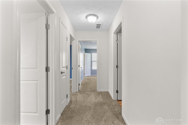 109 Waterford Blvd, Fairborn, OH 45324 - hallway with a textured ceiling and light carpet