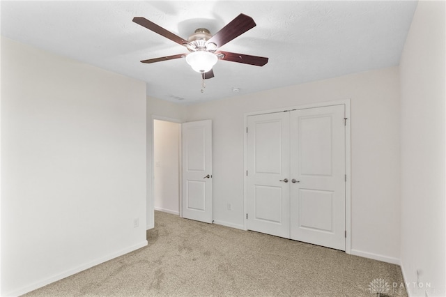 109 Waterford Blvd, Fairborn, OH 45324 - unfurnished bedroom featuring carpet flooring, a closet, and a ceiling fan