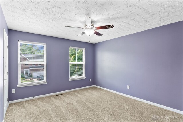 109 Waterford Blvd, Fairborn, OH 45324 - carpeted spare room featuring a ceiling fan and a textured ceiling