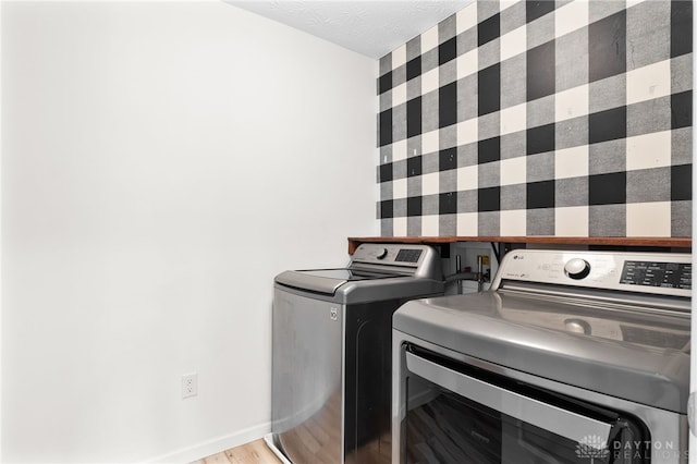 109 Waterford Blvd, Fairborn, OH 45324 - laundry room with separate washer and dryer, wallpapered walls, and light wood finished floors