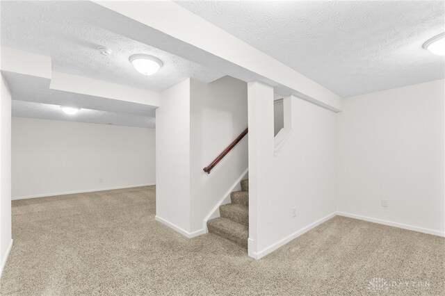 109 Waterford Blvd, Fairborn, OH 45324 - finished basement with a textured ceiling, carpet, and stairway