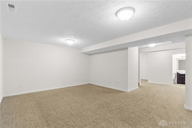 109 Waterford Blvd, Fairborn, OH 45324 - finished basement with light colored carpet and a textured ceiling
