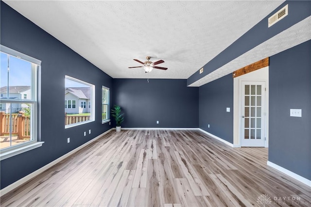 109 Waterford Blvd, Fairborn, OH 45324 - unfurnished room featuring a textured ceiling, wood finished floors, and ceiling fan
