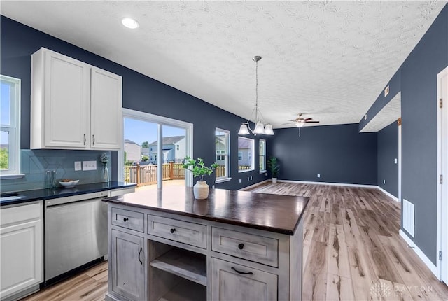 109 Waterford Blvd, Fairborn, OH 45324 - kitchen featuring dishwasher, a textured ceiling, light wood-style floors, open floor plan, and a ceiling fan