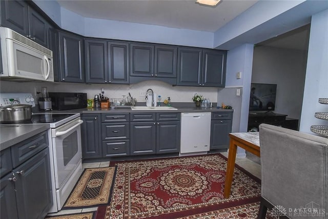 1629 Cohasset Dr, Anderson Twp, OH 45255 - kitchen with white appliances, a sink, and dark countertops