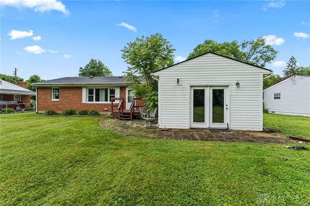 479 E Lomar Ave, Franklin, OH 45005 - rear view of property with a lawn, a deck, and brick siding