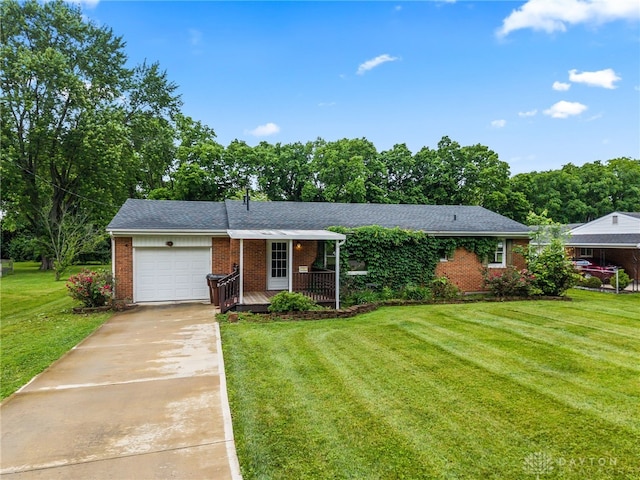 479 E Lomar Ave, Franklin, OH 45005 - single story home with brick siding, a garage, a front yard, and concrete driveway