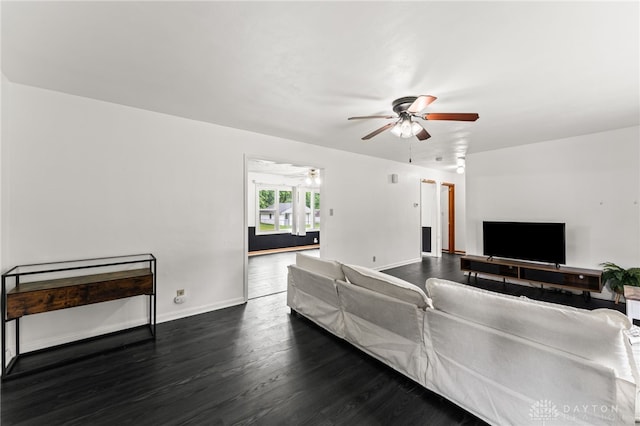 479 E Lomar Ave, Franklin, OH 45005 - living room featuring ceiling fan, dark wood-style floors, and baseboards