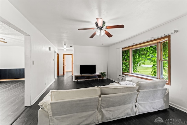 479 E Lomar Ave, Franklin, OH 45005 - living room featuring a ceiling fan, dark wood-style flooring, and baseboards