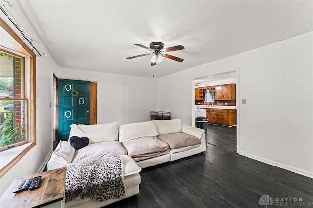 479 E Lomar Ave, Franklin, OH 45005 - living area with ceiling fan, dark wood-style floors, and baseboards