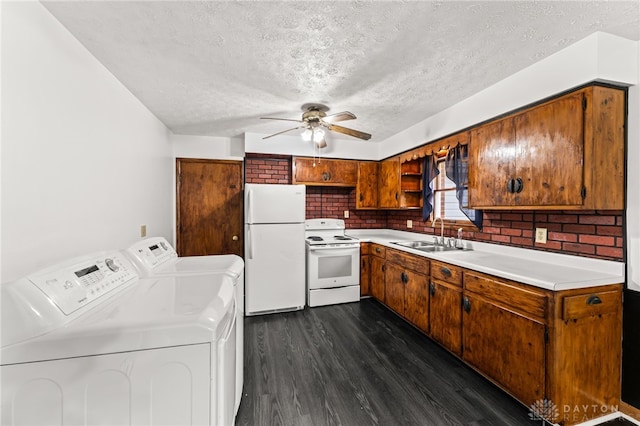479 E Lomar Ave, Franklin, OH 45005 - kitchen featuring white appliances, a sink, washer and clothes dryer, dark wood-style floors, and a textured ceiling