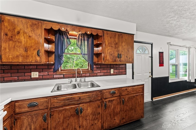 479 E Lomar Ave, Franklin, OH 45005 - kitchen featuring a sink, open shelves, light countertops, dark wood finished floors, and a textured ceiling