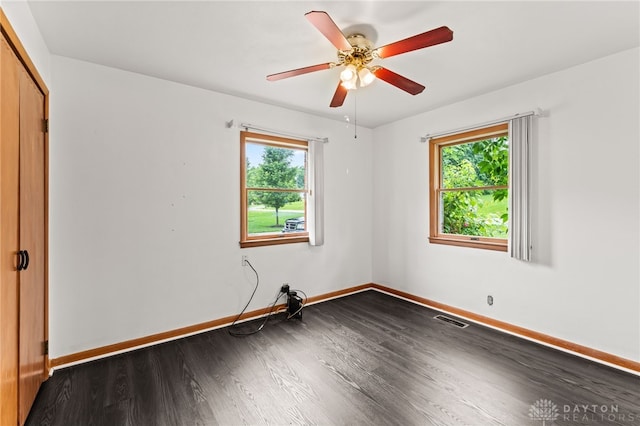 479 E Lomar Ave, Franklin, OH 45005 - spare room with dark wood-style flooring, baseboards, and ceiling fan