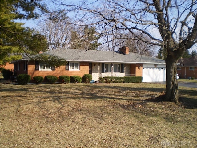 1086 Grange Hall Rd, Beavercreek, OH 45430 - single story home with a chimney, brick siding, a garage, and a front yard
