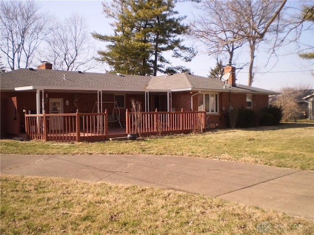 1086 Grange Hall Rd, Beavercreek, OH 45430 - single story home featuring a chimney, a deck, brick siding, and a front yard