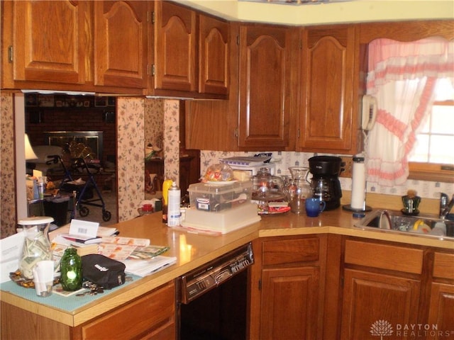 1086 Grange Hall Rd, Beavercreek, OH 45430 - kitchen featuring dishwasher, light countertops, brown cabinets, and a sink