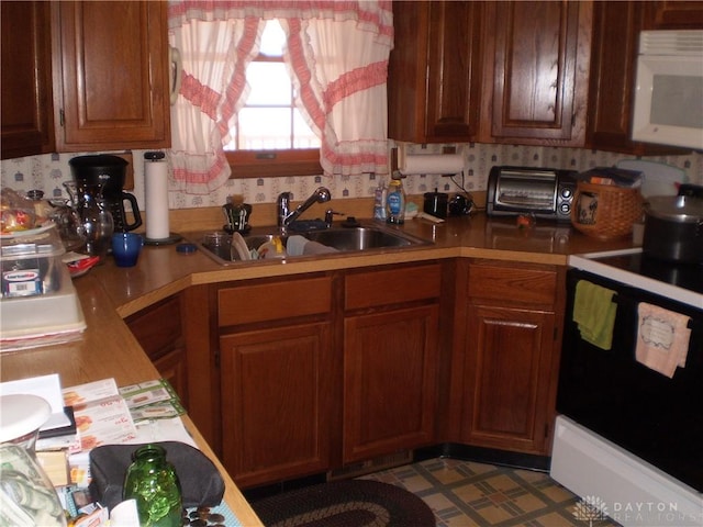 1086 Grange Hall Rd, Beavercreek, OH 45430 - kitchen with a sink, white microwave, electric stove, light countertops, and tile patterned floors
