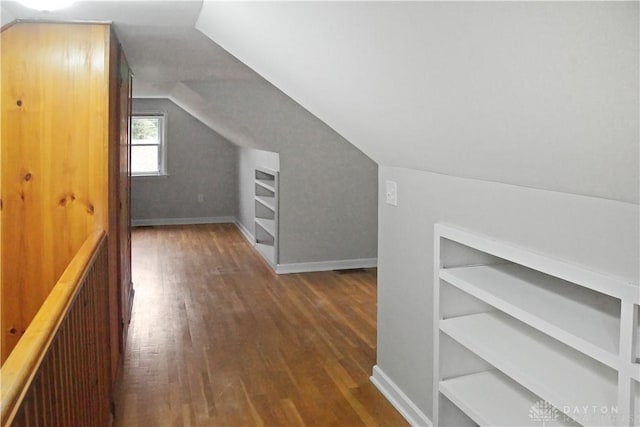 3145 Mohican Ave, Kettering, OH 45429 - additional living space with built in shelves, wood finished floors, lofted ceiling, and baseboards