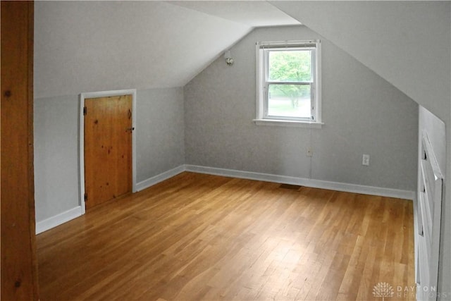 3145 Mohican Ave, Kettering, OH 45429 - additional living space with wood finished floors, baseboards, and vaulted ceiling