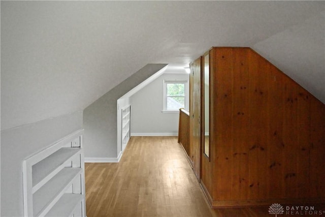 3145 Mohican Ave, Kettering, OH 45429 - additional living space with vaulted ceiling, light wood-style floors, and baseboards